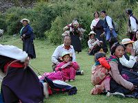 Tibetans relaxing on the hills near the monastery.